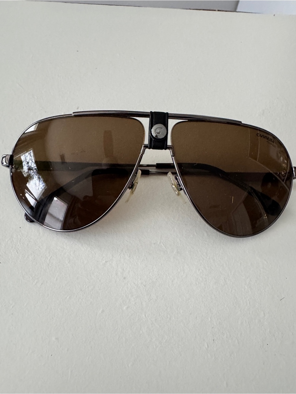 Carrera polarized sunglasses with Brown Lenses and Black Leather Bridge logo